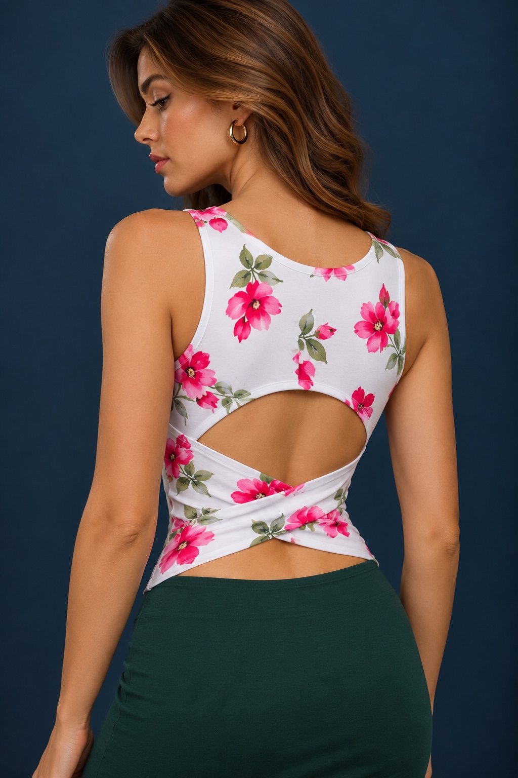 Back view of a white floral viscose tango top with pink flowers, featuring an open back and crossed twist detail.