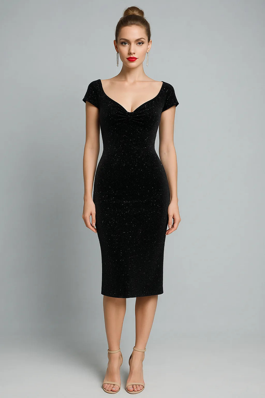 Woman wearing a black tango dress against a gray background