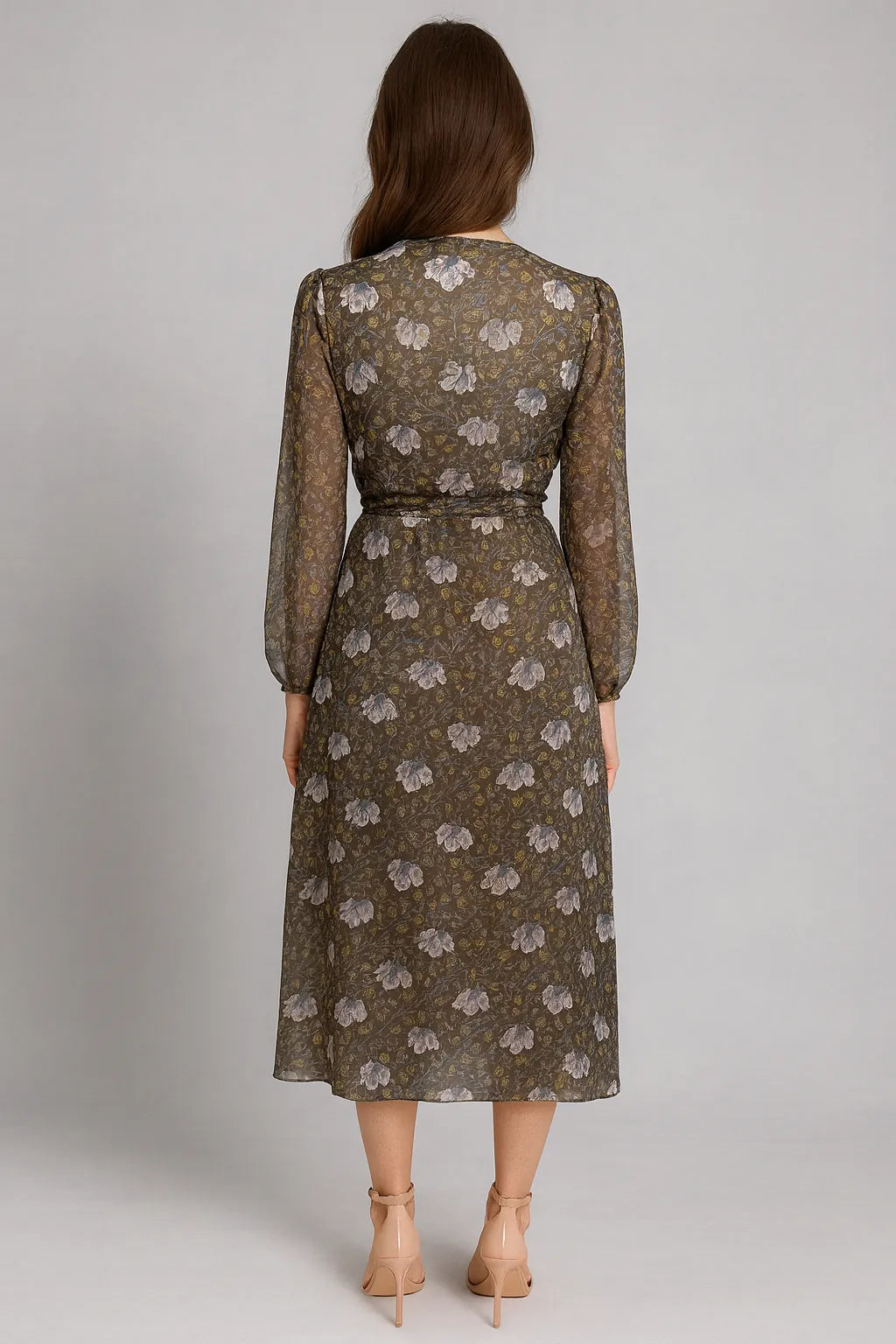 Feminine green wrap dress with flowing skirt and romantic details