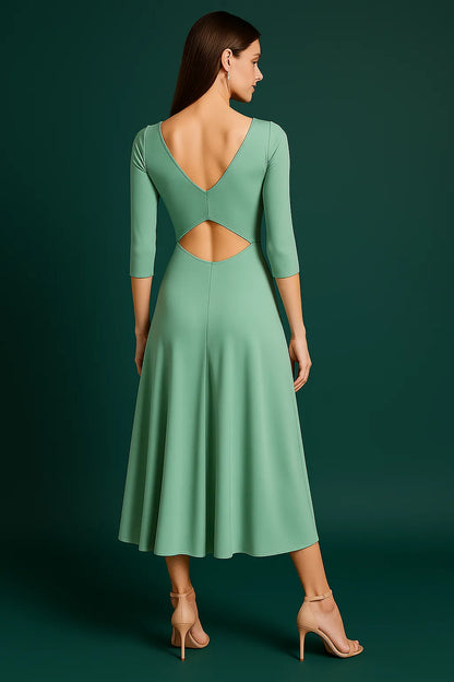 Striking pistachio dress with fitted bodice and dramatic back