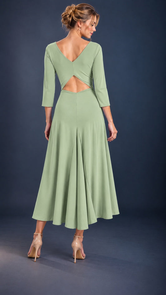 Back view of a pistachio green women’s tango dress with three-quarter sleeves, a flowing skirt and elegant open-back cutout.