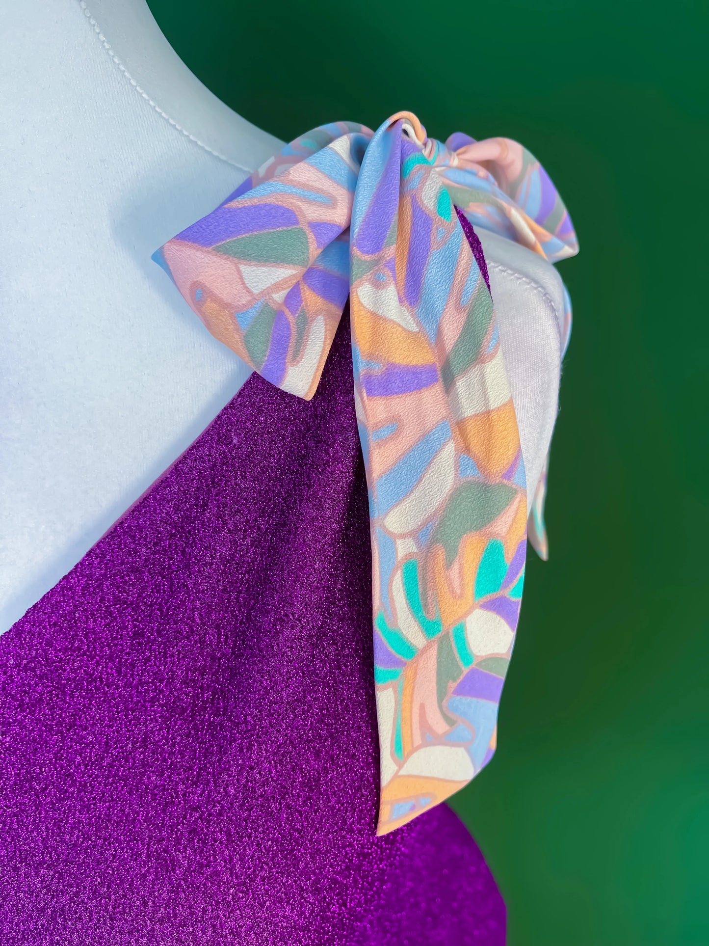 Shimmering one-shoulder tango top with bow detail