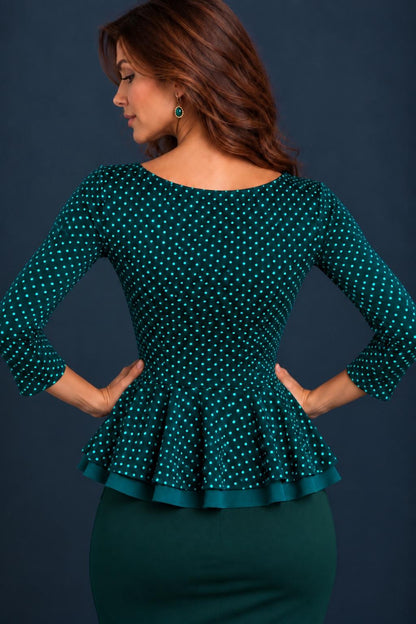 Back view of a green polka dot jersey tango top with three-quarter sleeves and a double-layer peplum.