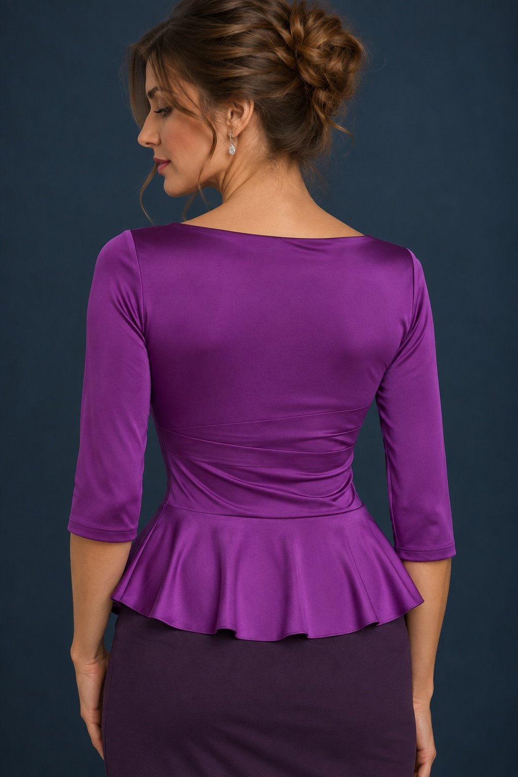 Back view of a purple silky jersey tango top with three-quarter sleeves and a fluid flared peplum.