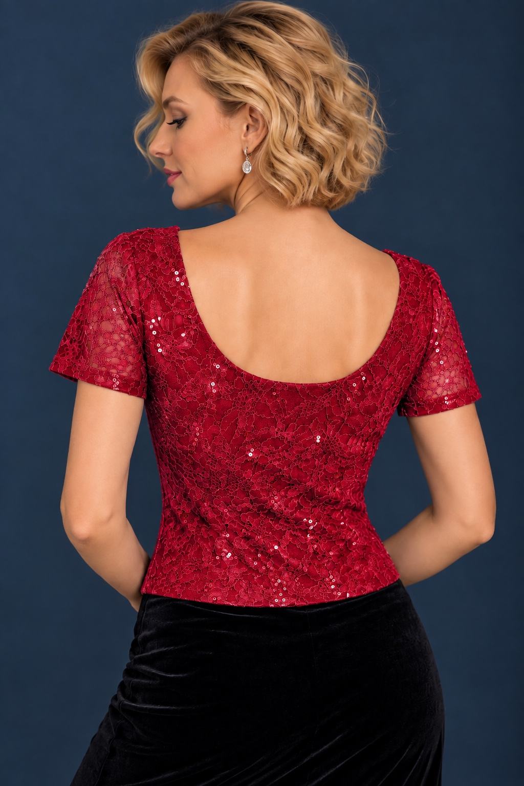 Back view of women’s tango top in shimmering sequin lace with short sleeves, soft lining, fitted silhouette, and deep rounded back.