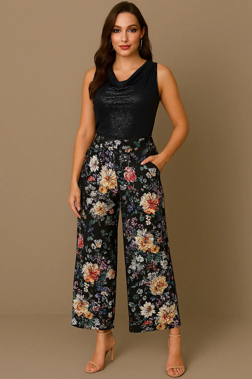 Woman wearing a black sleeveless tango top and floral tango pants