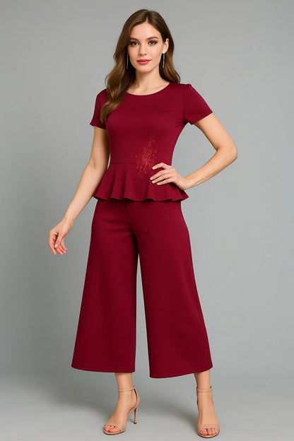 Woman wearing a red peplum top and wide-leg tango pants