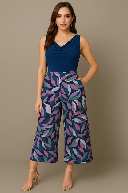 Woman wearing a blue sleeveless tango top and patterned tango pants