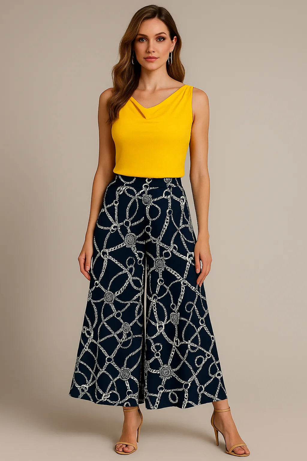 Woman wearing a yellow tango top and navy patterned tango pants on a beige background