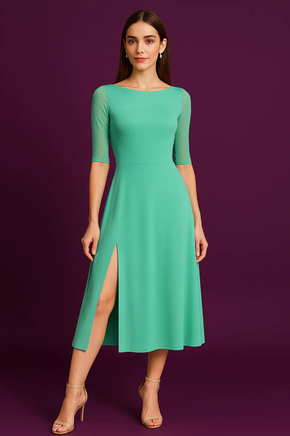 Woman wearing a teal tango dress with a slit on a purple background