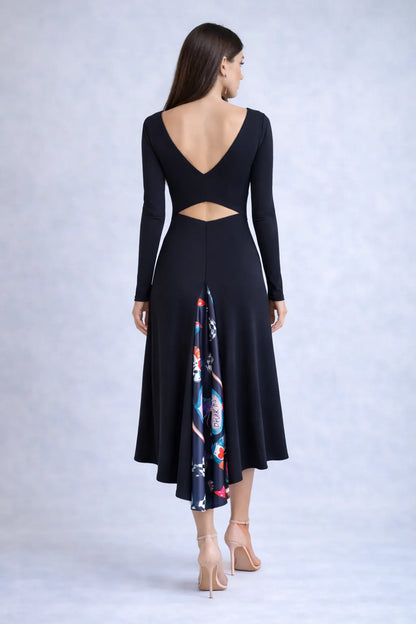 Woman wearing a black tango dress with a colorful back panel
