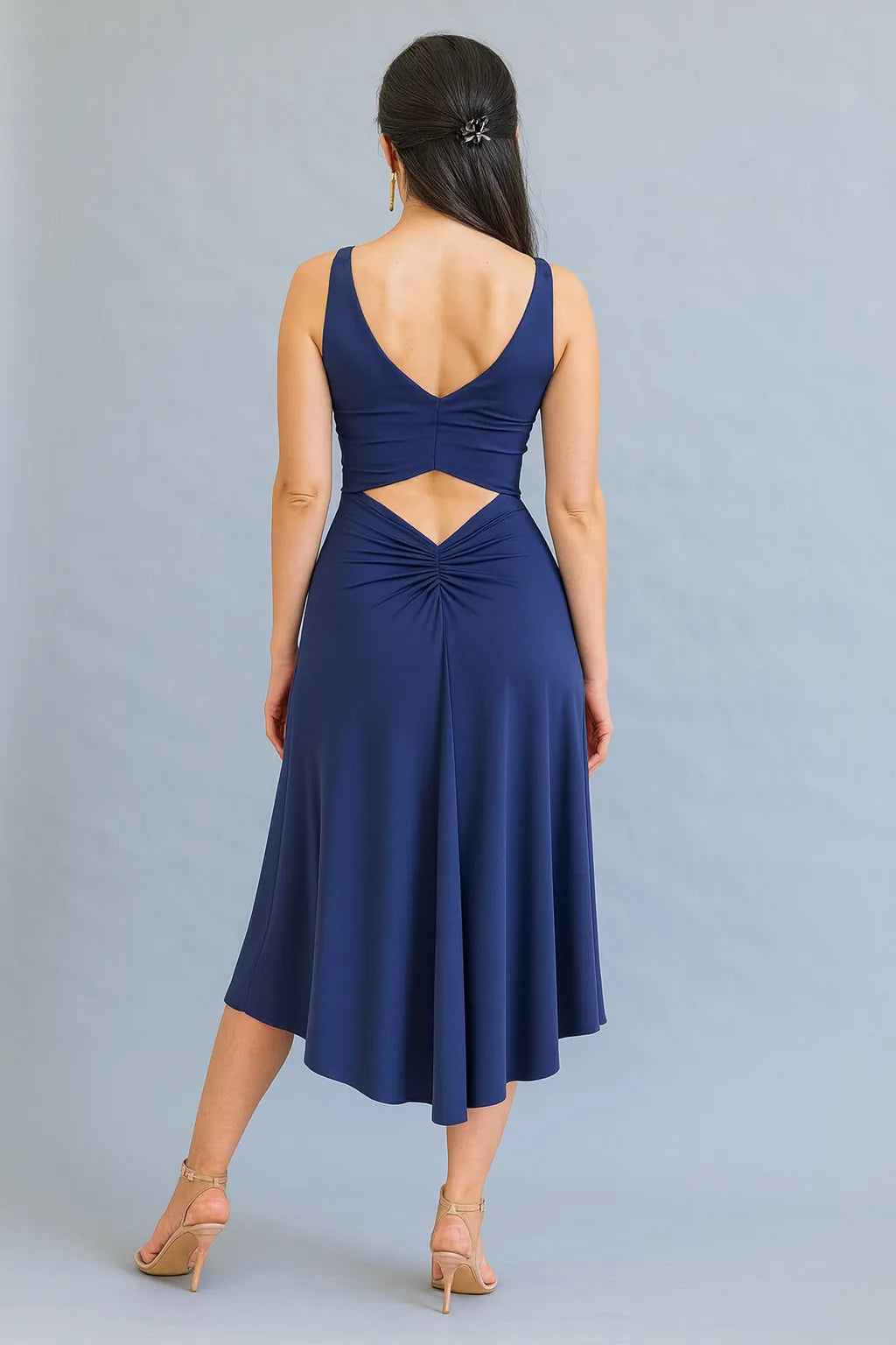 Navy blue tango dress with cutout back on a gray background