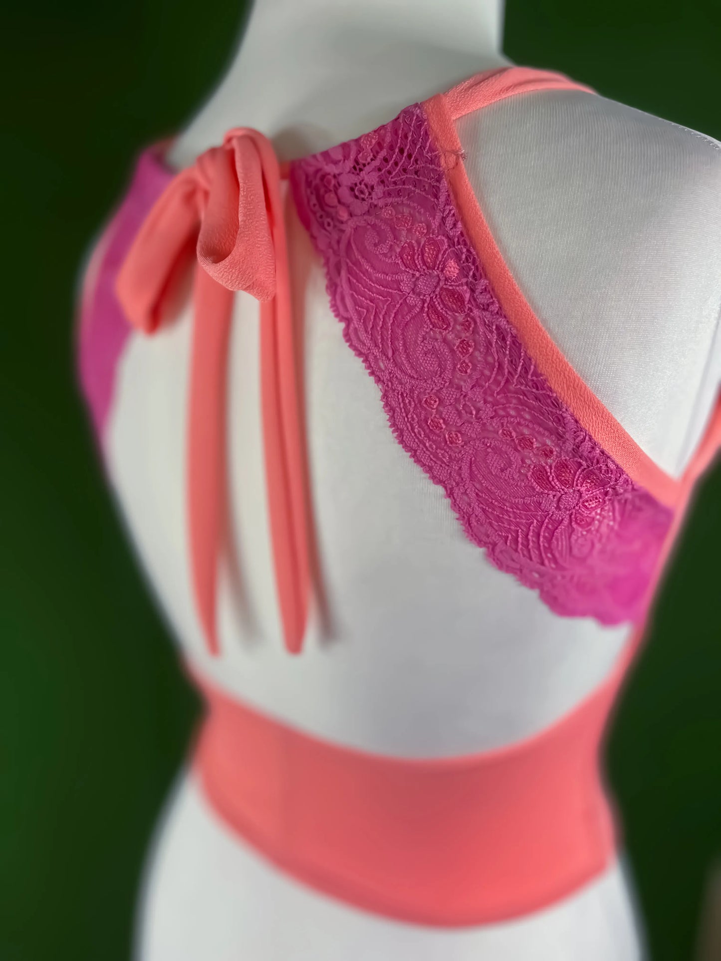 Elegant pink stretch tango top with adjustable tie-neck and lace details