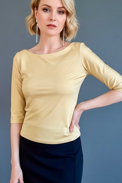 Woman wearing a yellow tango top and dark skirt