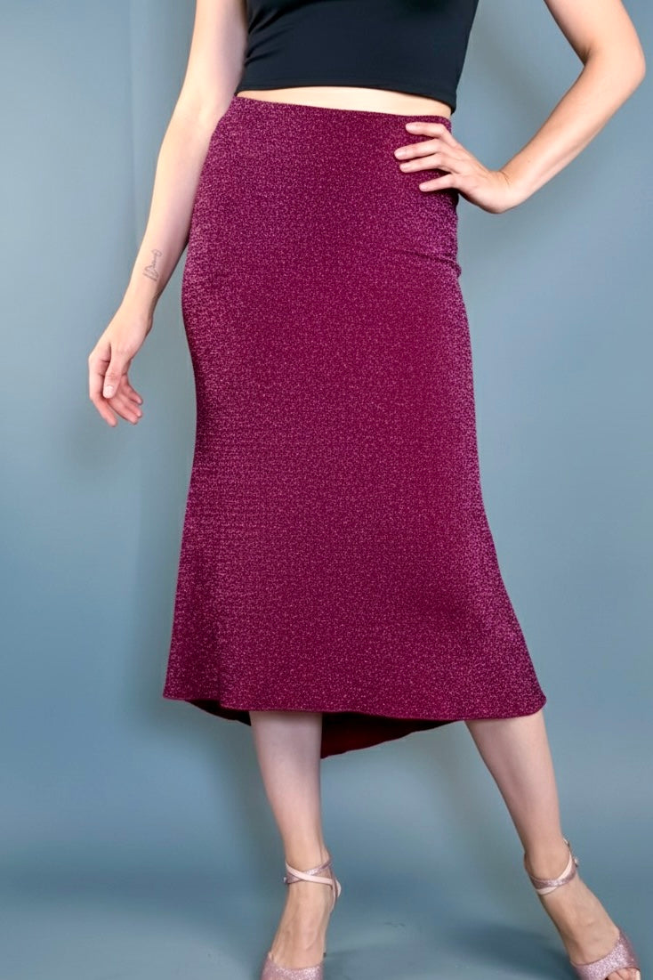 Person wearing a maroon tango skirt.
