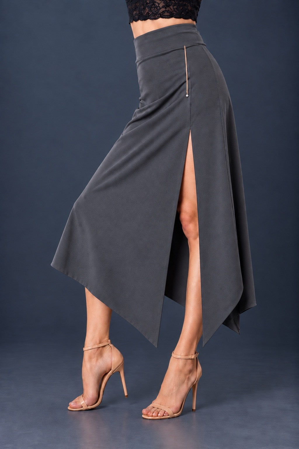 Grey asymmetric jersey tango skirt with wide waistband, front slit and angled hem.