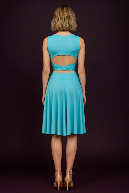 Woman wearing a turquoise tango skirt with cut-out design on a dark background, back view