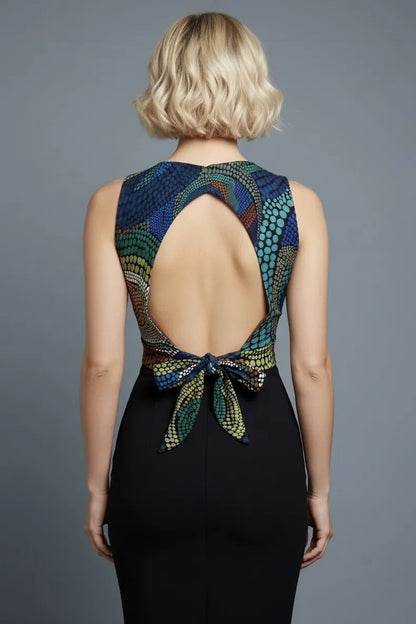 Woman wearing a colorful open-back viscose tango top, back view