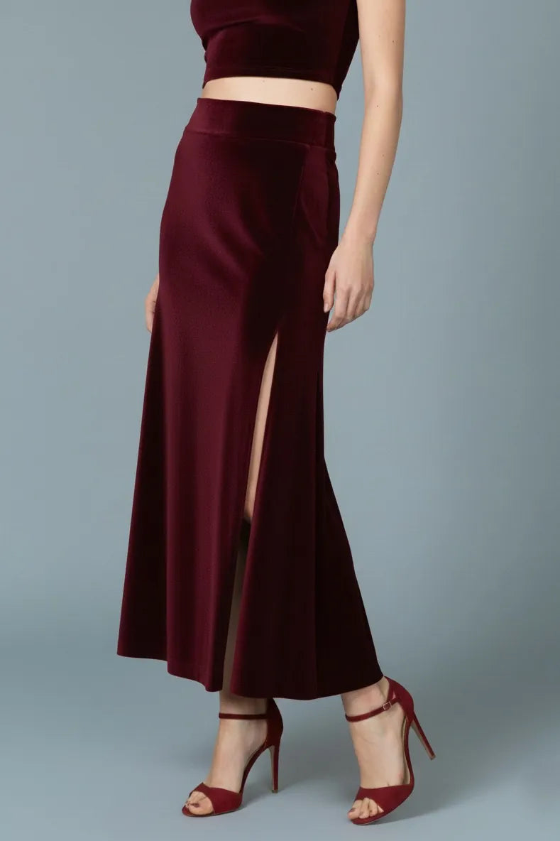 Woman wearing a velvet tango skirt with high waist