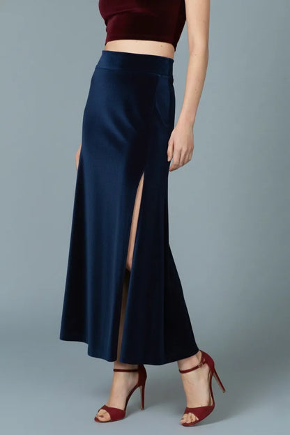 Woman wearing a velvet navy tango skirt