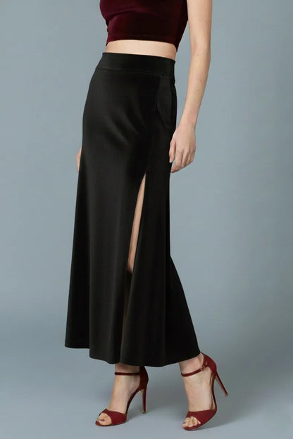 Woman wearing a black velvet tango skirt with a high waist