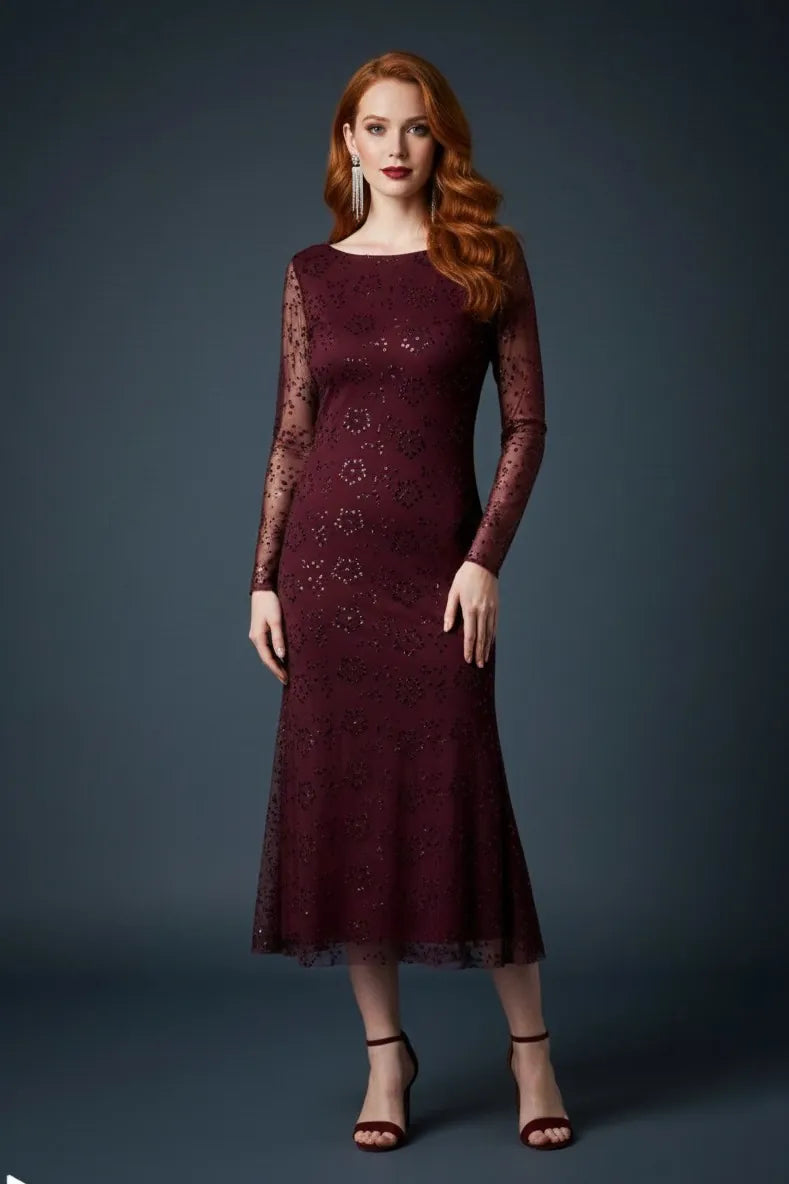 Woman wearing a deep bordeaux lace tango dress against a dark background, front view