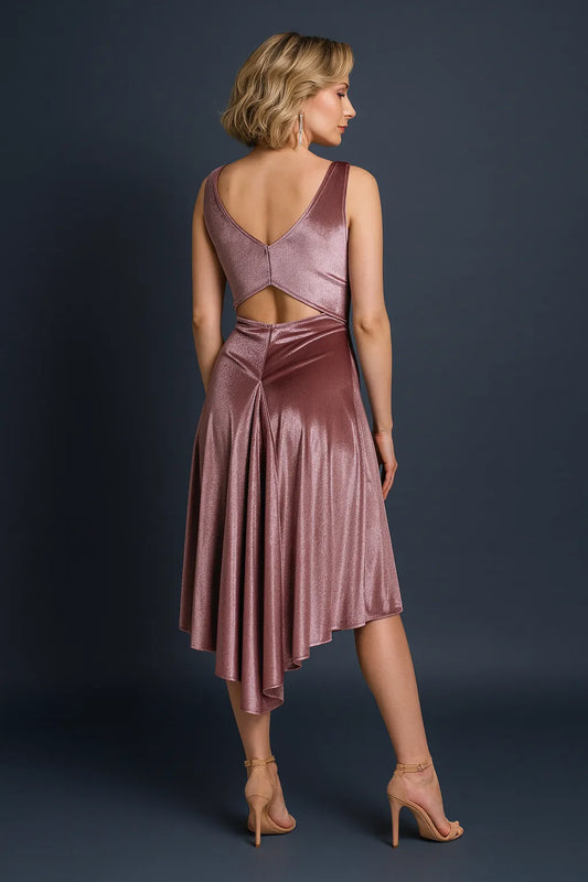 Woman wearing a dusty rose tango dress with cut-out design on a dark background, back view