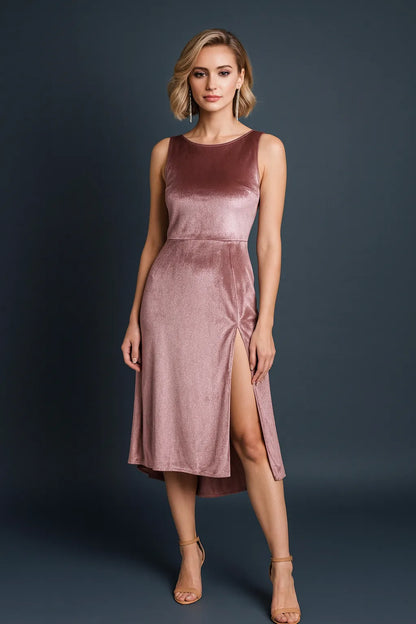 Woman wearing a dusty rose tango dress against a dark background, front view.