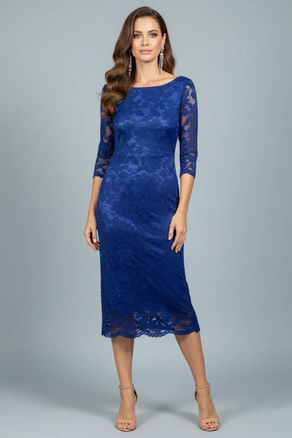 Woman wearing a blue lace tango dress against a gray background, front view.