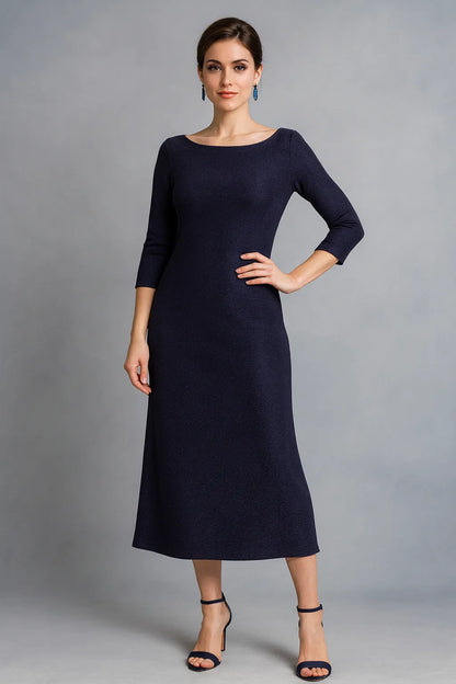 Woman wearing a dark violet tango dress against a gray background