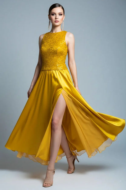 Woman wearing a golden tango dress with a slit on a gray background