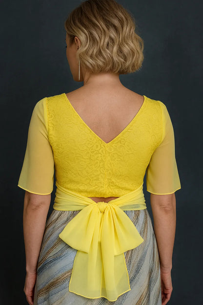 Woman wearing a yellow lace tango top, back view
