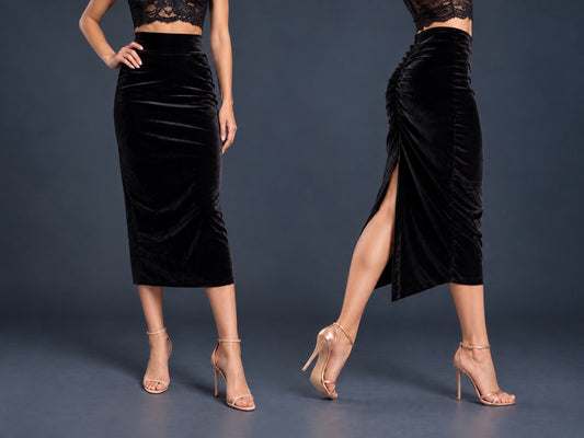 Women’s black velvet tango skirt with a fitted midi silhouette, wide waistband, gathered back, back slit and distinctive swallowtail hem, shown from front and side views.