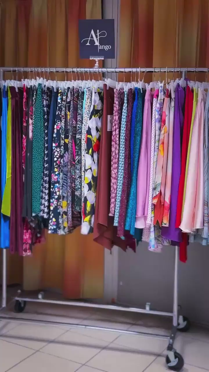 Video of a woman wearing a blue velvet tango skirt with high waist