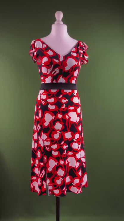 Graceful stretch jersey tango dress with flutter sleeves and back tail