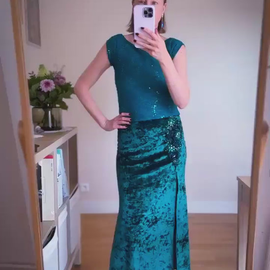 Video of a woman wearing a teal velvet tango skirt