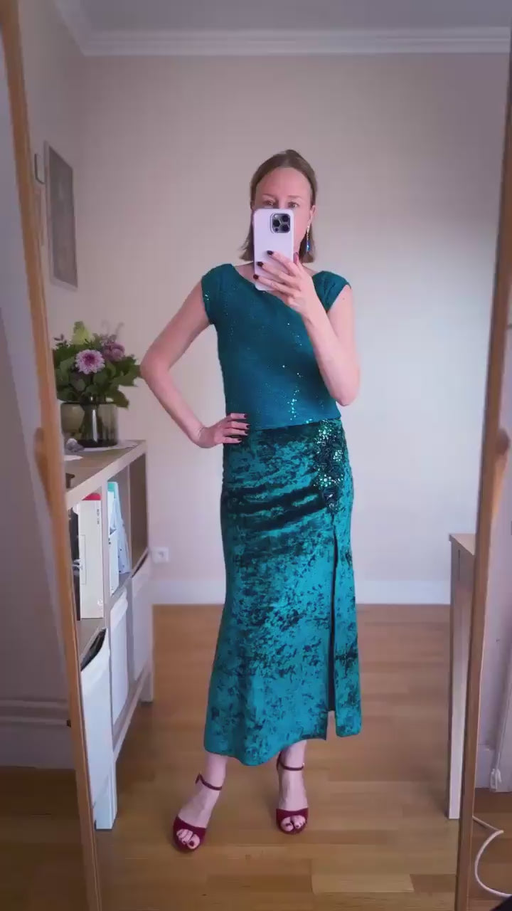 Video of a woman wearing a teal velvet tango skirt