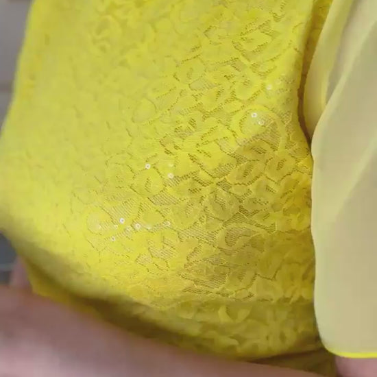 Video of a woman in yellow lace tango top