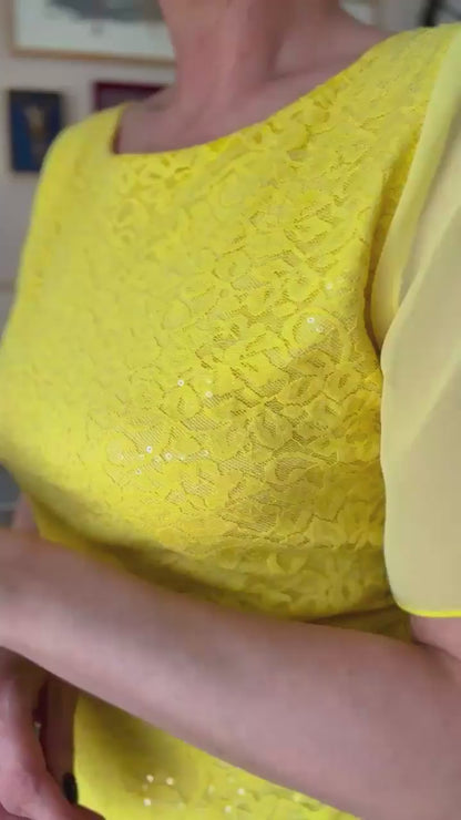 Video of a woman in yellow lace tango top
