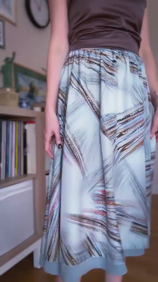 Video of a woman in two layer flowing tango skirt