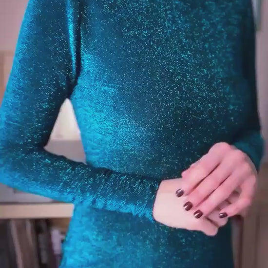 Woman wearing an elegant sea tango dress with long sleeves