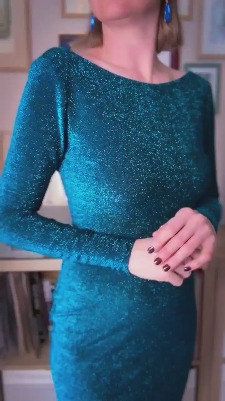 Woman wearing an elegant sea tango dress with long sleeves