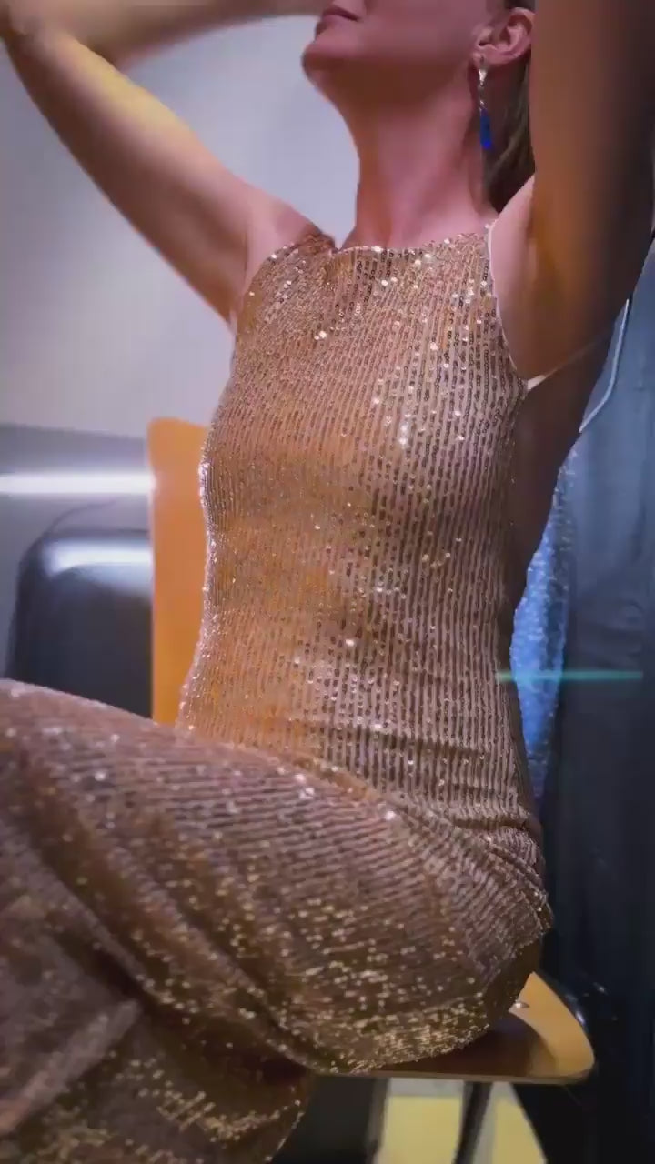 Woman wearing a golden sequin tango dress