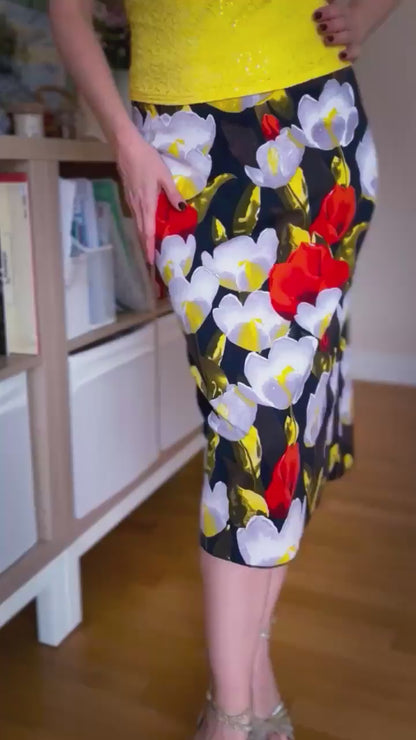 Video of a woman in a floral tango skirt