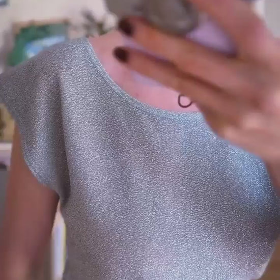 Video of a woman in silver shimmer tango top and grey tango skirt