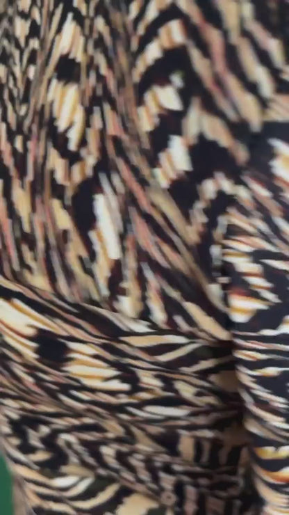 Knit tango dress with deep V-back and knot detail