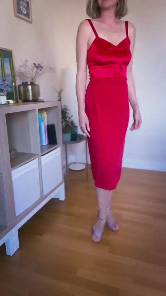 Video of a woman wearing a red tango top and wrap red tango skirt