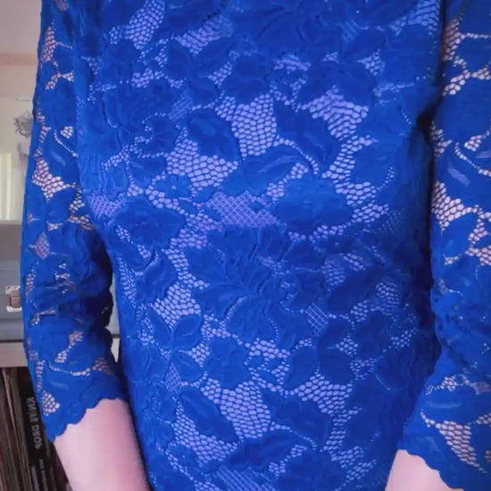 Video of a woman wearing a blue lace tango dress