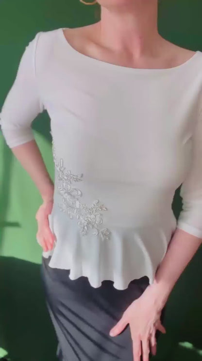 Feminine tango top with basque detail and shimmer accent