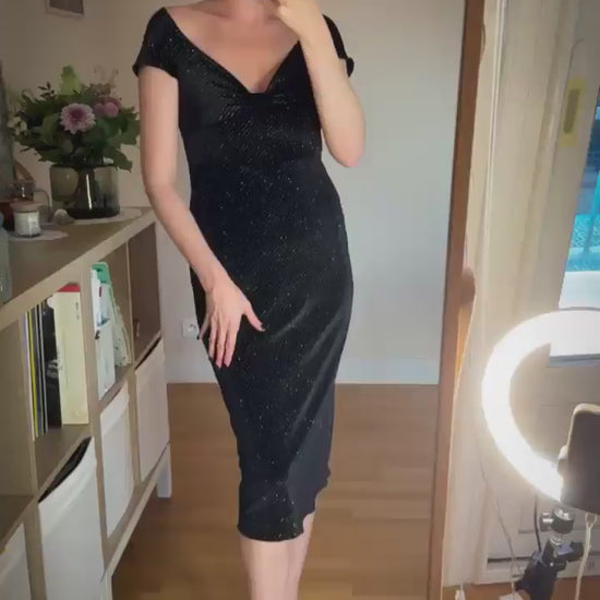 Video of a woman in black velvet tango dress
